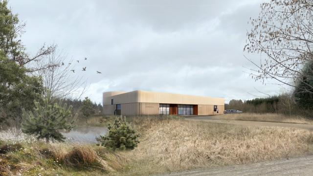 Visualiseringen af det kommende Anebjerg Vandværk. De grønne tage og materialevalg tager både hensyn til miljøet og omgivelserne i Anebjerg Skov.